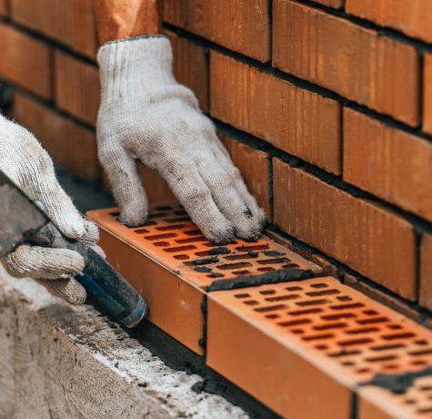 Team from KS Roof Master Limited performing brickwork repair in London, UK
