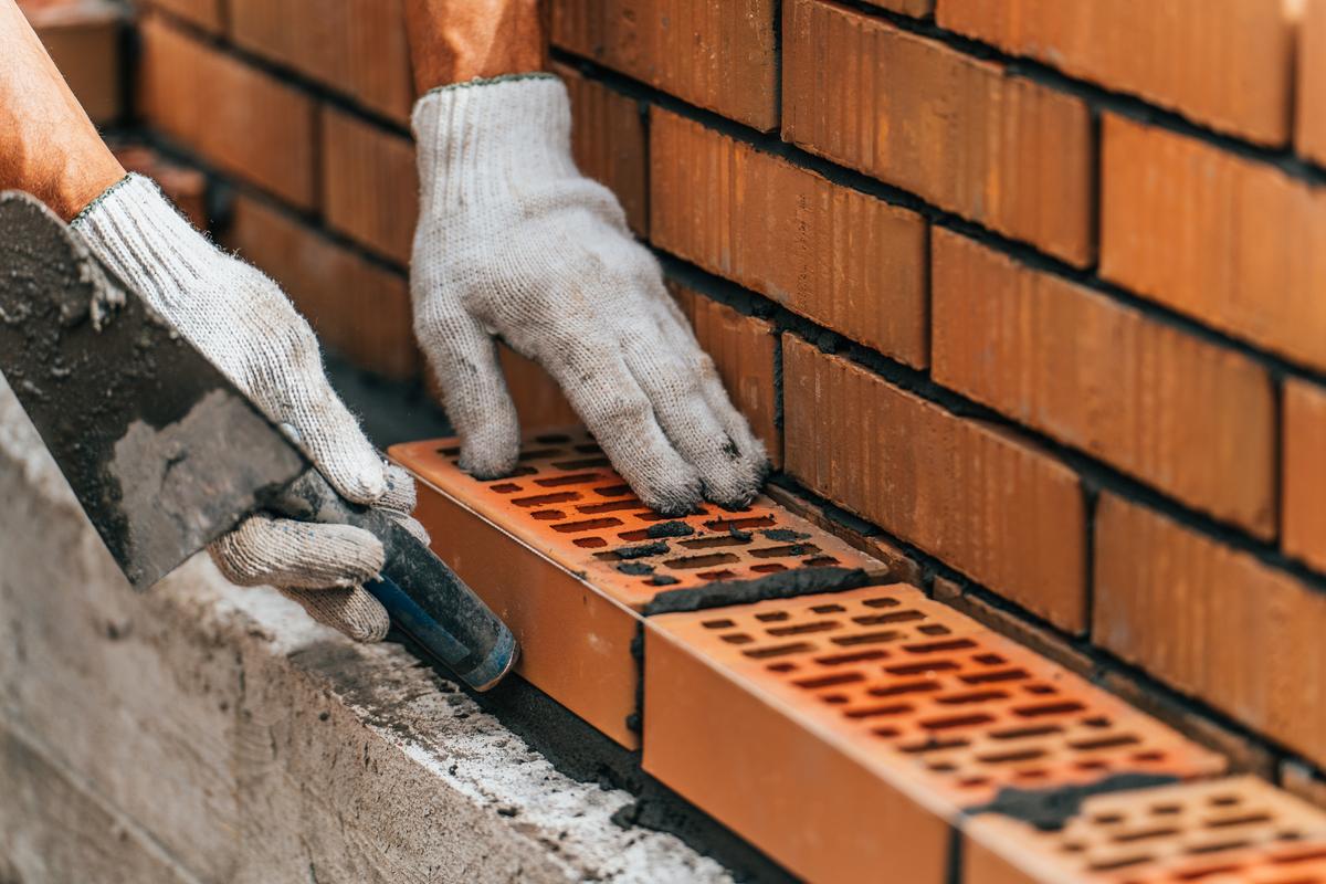 Team from KS Roof Master Limited performing brickwork repair in London, UK