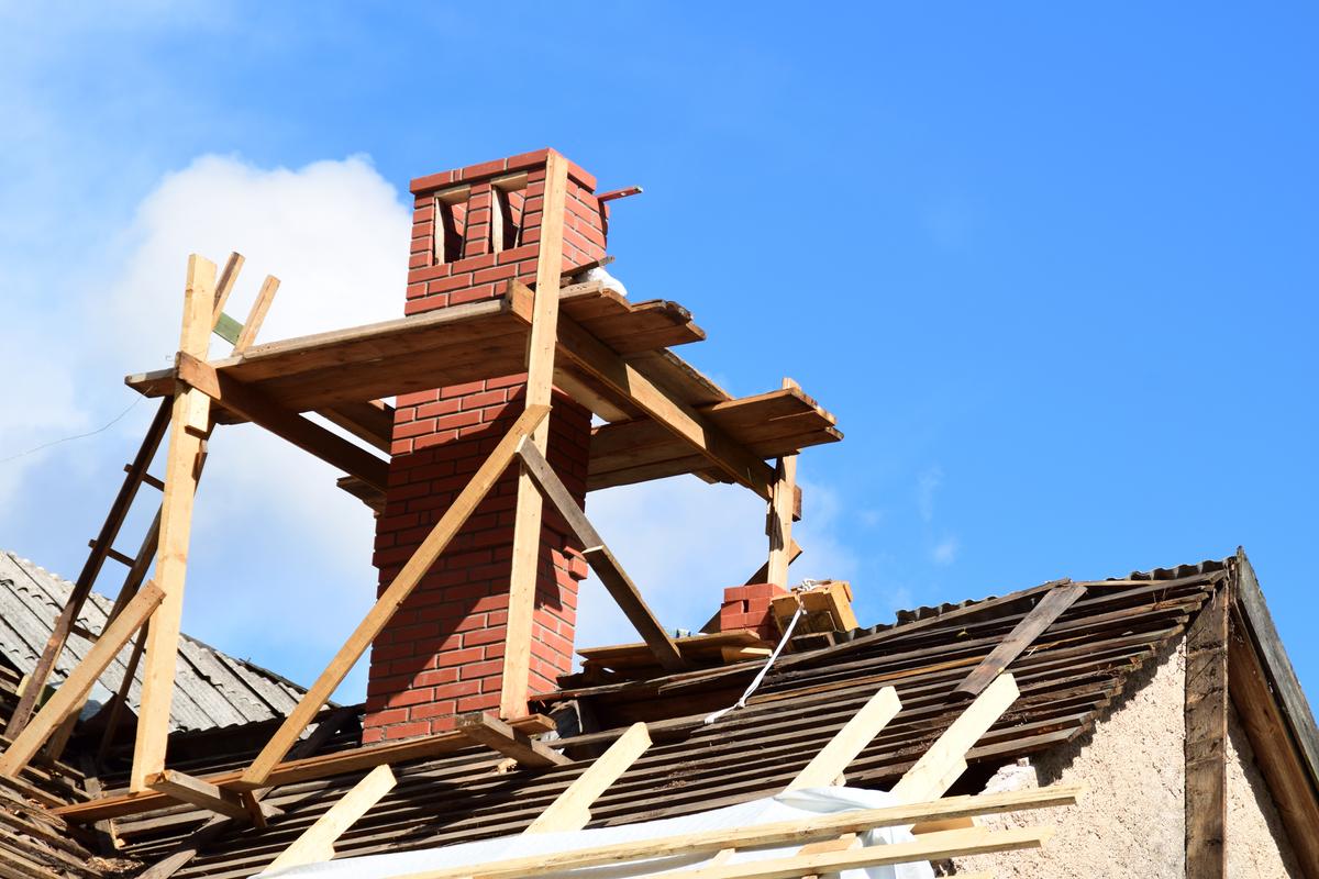 KS Roof Master Limited team undertaking chimney and party wall repair in London, UK